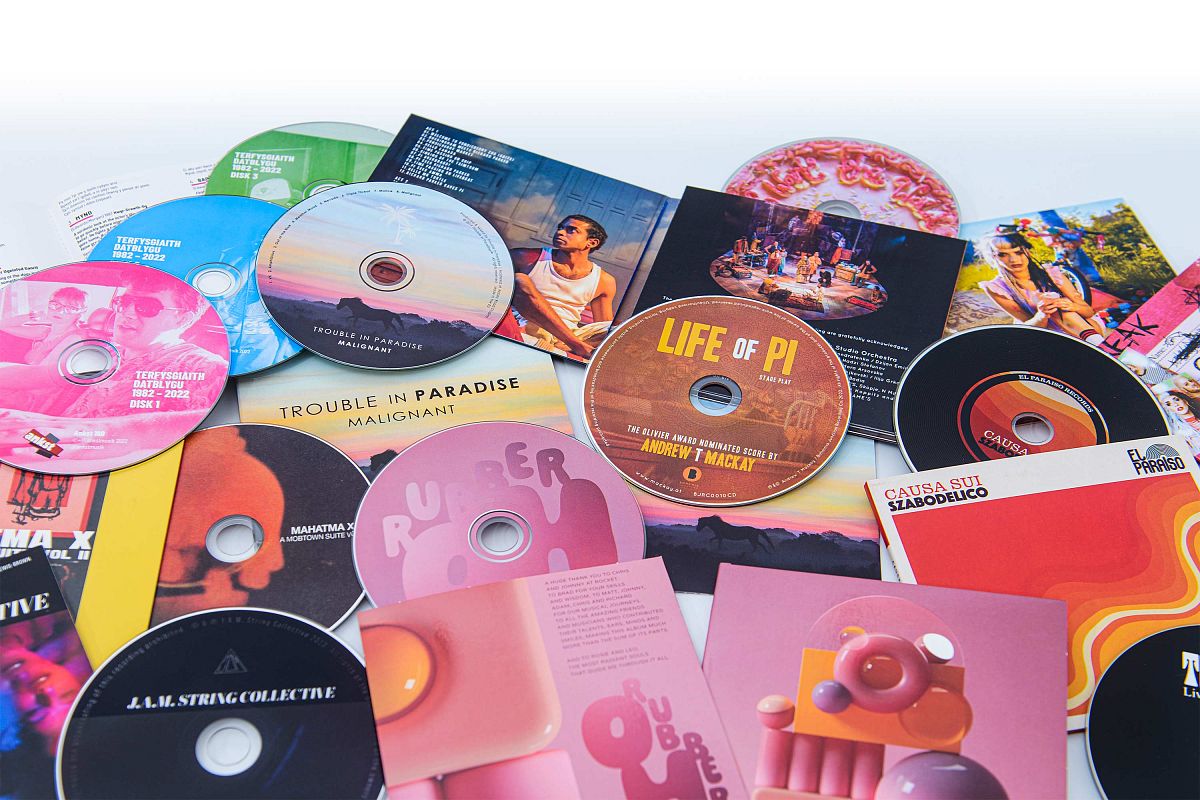 Selection of CDs in card wallets, digifiles and digipaks packaging..